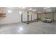 Spacious garage with car lift and ample storage at 2124 E Virginia St, Mesa, AZ 85213