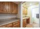 Laundry room with built-in cabinets and washer/dryer at 2124 E Virginia St, Mesa, AZ 85213