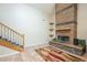 Living room with fireplace and staircase at 2124 E Virginia St, Mesa, AZ 85213