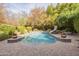 Resort-style pool with brick pavers and slide at 2124 E Virginia St, Mesa, AZ 85213