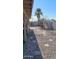 Small backyard with gravel, a palm tree, and metal fencing at 2270 S Apache Dr, Apache Junction, AZ 85120