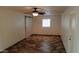 Spacious bedroom with tile floors, barn door, and neutral walls at 2270 S Apache Dr, Apache Junction, AZ 85120