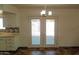 Kitchen dining area with French doors leading to the backyard at 2270 S Apache Dr, Apache Junction, AZ 85120