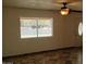 Bright living room featuring tile floors and a large window at 2270 S Apache Dr, Apache Junction, AZ 85120