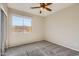 Spacious bedroom with carpet flooring and ceiling fan at 29302 N 126Th Ln, Peoria, AZ 85383