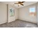 Bright bedroom with carpet flooring and ceiling fan at 29302 N 126Th Ln, Peoria, AZ 85383