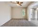 Bright bedroom with carpeted floor and ceiling fan at 29302 N 126Th Ln, Peoria, AZ 85383