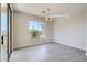 Dining area with tile floors and sliding glass door to patio at 29302 N 126Th Ln, Peoria, AZ 85383