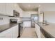 Modern kitchen with stainless steel appliances and an island at 29302 N 126Th Ln, Peoria, AZ 85383