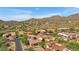 Aerial view of luxury home community with desert landscape and mountain views at 3257 N Piedra Cir, Mesa, AZ 85207