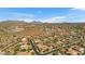 Aerial view of luxury home community with desert landscape and mountain views at 3257 N Piedra Cir, Mesa, AZ 85207