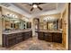 Double vanity bathroom with granite countertops and mosaic tile floor at 3257 N Piedra Cir, Mesa, AZ 85207