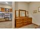 Bright walk-in closet with custom shelving and dresser at 3257 N Piedra Cir, Mesa, AZ 85207