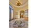 Grand entry with circular mosaic tile and chandelier at 3257 N Piedra Cir, Mesa, AZ 85207