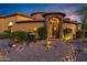 Stunning upscale home with stone accents and wrought iron gates at 3257 N Piedra Cir, Mesa, AZ 85207