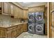 Laundry room with washer, dryer, and ample cabinetry at 3257 N Piedra Cir, Mesa, AZ 85207