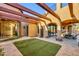 Covered patio with seating area and outdoor kitchen at 3257 N Piedra Cir, Mesa, AZ 85207