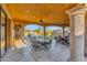 Spacious covered patio with dining area and ceiling fans at 3257 N Piedra Cir, Mesa, AZ 85207