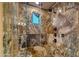 Large walk-in shower with marble tile and multiple shower heads at 3257 N Piedra Cir, Mesa, AZ 85207