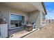 Covered patio with seating area, fire pit, and desert landscaping at 3422 N Cinnabar Pl, Casa Grande, AZ 85122