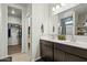 Bathroom with double vanity, shower, and linen closet at 3422 N Cinnabar Pl, Casa Grande, AZ 85122