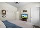 Main bedroom with a TV and ample closet space at 3422 N Cinnabar Pl, Casa Grande, AZ 85122