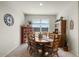 Bright dining room with wooden table, chairs, and a built-in hutch at 3422 N Cinnabar Pl, Casa Grande, AZ 85122