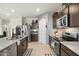 Modern kitchen with stainless steel appliances and a large island with sink at 3422 N Cinnabar Pl, Casa Grande, AZ 85122