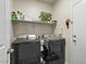 Laundry room with washer, dryer, and storage shelves at 3422 N Cinnabar Pl, Casa Grande, AZ 85122