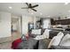 Spacious living room with comfortable sectional sofa and views into the kitchen at 3422 N Cinnabar Pl, Casa Grande, AZ 85122