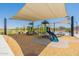 Modern playground with shade structures and play equipment for children at 3751 E Archer Dr, San Tan Valley, AZ 85140