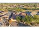 Aerial view of single-story home with solar panels, near golf course at 3755 N 161St Ave, Goodyear, AZ 85395