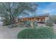 Landscaped backyard with desert plants and a relaxing hammock at 3755 N 161St Ave, Goodyear, AZ 85395