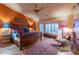 Spacious bedroom with wooden bed frame and southwestern decor at 3755 N 161St Ave, Goodyear, AZ 85395