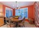 Bright dining area with a wood table and four chairs, near a window at 3755 N 161St Ave, Goodyear, AZ 85395