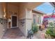 Welcoming entryway with terracotta tile floor and unique wall decor at 3755 N 161St Ave, Goodyear, AZ 85395