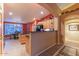 Well-equipped kitchen with island, granite countertops, and wood cabinetry at 3755 N 161St Ave, Goodyear, AZ 85395