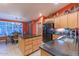 Modern kitchen with stainless steel appliances, an island, and granite countertops at 3755 N 161St Ave, Goodyear, AZ 85395