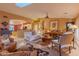 Open and airy living room with comfortable seating and a view into the kitchen at 3755 N 161St Ave, Goodyear, AZ 85395