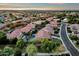 Aerial view of house, pool, and surrounding neighborhood at 3829 E Sawtooth Dr, Chandler, AZ 85249