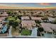 Aerial view of two story house with pool and landscaped yard at 3829 E Sawtooth Dr, Chandler, AZ 85249