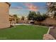 Spacious backyard with pool, fire pit, and lush landscaping at 3829 E Sawtooth Dr, Chandler, AZ 85249