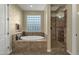 Spa-like bathroom with a large soaking tub and a walk-in shower at 3829 E Sawtooth Dr, Chandler, AZ 85249