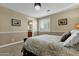 Bright bedroom with ensuite bathroom and window shutters at 3829 E Sawtooth Dr, Chandler, AZ 85249