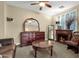 Relaxing bedroom with a fireplace, dresser, and comfy seating area at 3829 E Sawtooth Dr, Chandler, AZ 85249