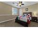 Charming bedroom with a baseball-themed bedspread and built-in drawers at 3829 E Sawtooth Dr, Chandler, AZ 85249