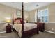 Bedroom with a four-poster bed and window shutters at 3829 E Sawtooth Dr, Chandler, AZ 85249