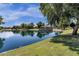 Peaceful lake with a gazebo and lush greenery at 3829 E Sawtooth Dr, Chandler, AZ 85249