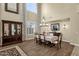 Elegant dining room featuring a large table, chandelier, and hardwood floors at 3829 E Sawtooth Dr, Chandler, AZ 85249