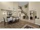 Open dining room with hardwood floors and a view of the staircase at 3829 E Sawtooth Dr, Chandler, AZ 85249